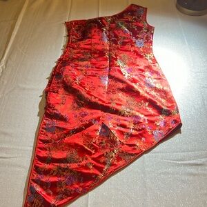 Polyester and Nylon, very vibrant Asymmetrical designed , custom suited dress